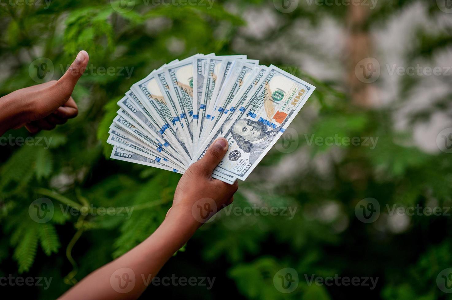 Hand and dollar pictures Concept of business finance photo