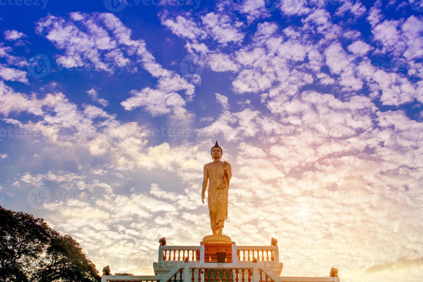 Standing Buddha image And the blue sky, religious concepts photo