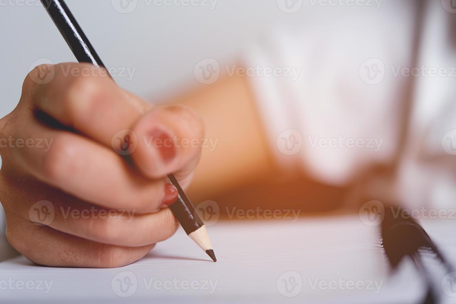 Hand and pencil pictures of students writing Education concept With copy space photo