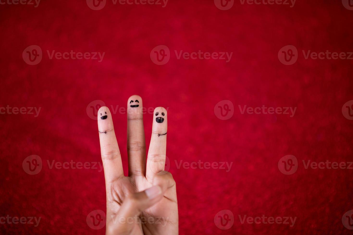 Red background and fingers and cute smile Art concept photo