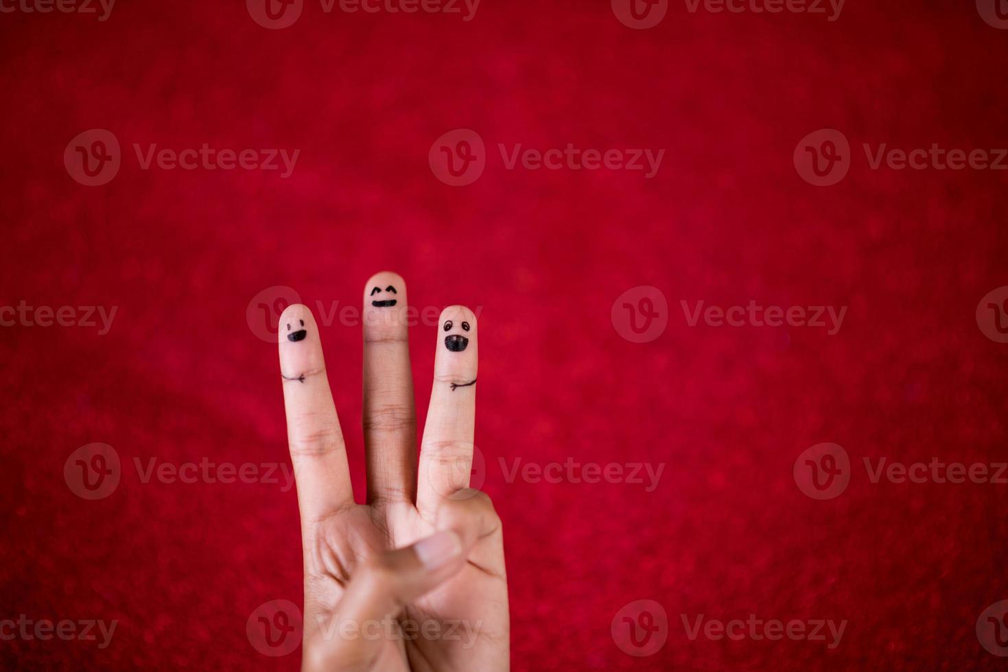 Red background and fingers and cute smile Art concept photo