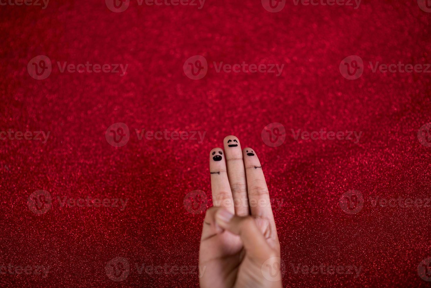 Red background and fingers and cute smile Art concept photo