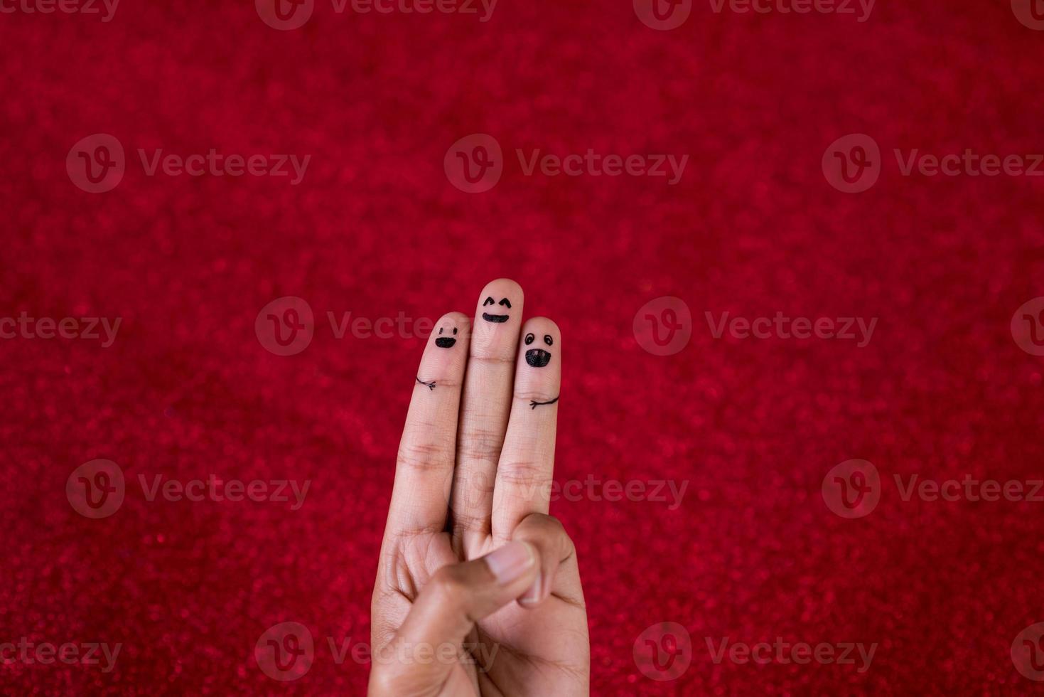 Red background and fingers and cute smile Art concept photo