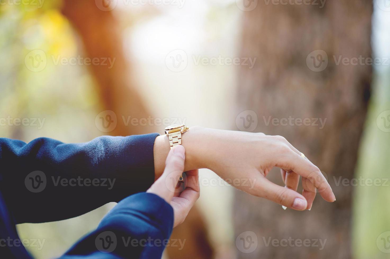 Hands and wrist watches worn Time view concept With copy space photo