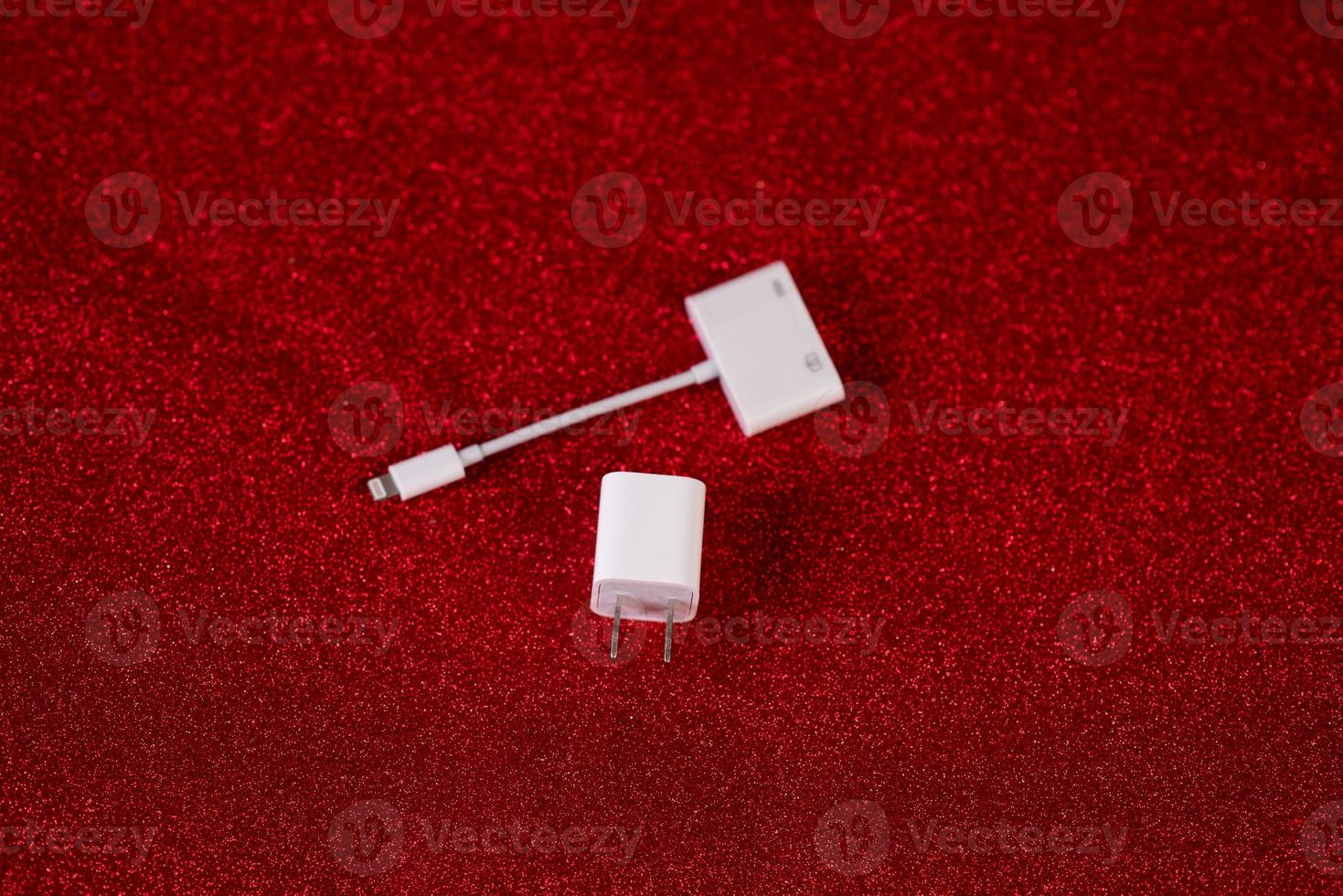 Red background image and USB computer plug device Technology concept photo