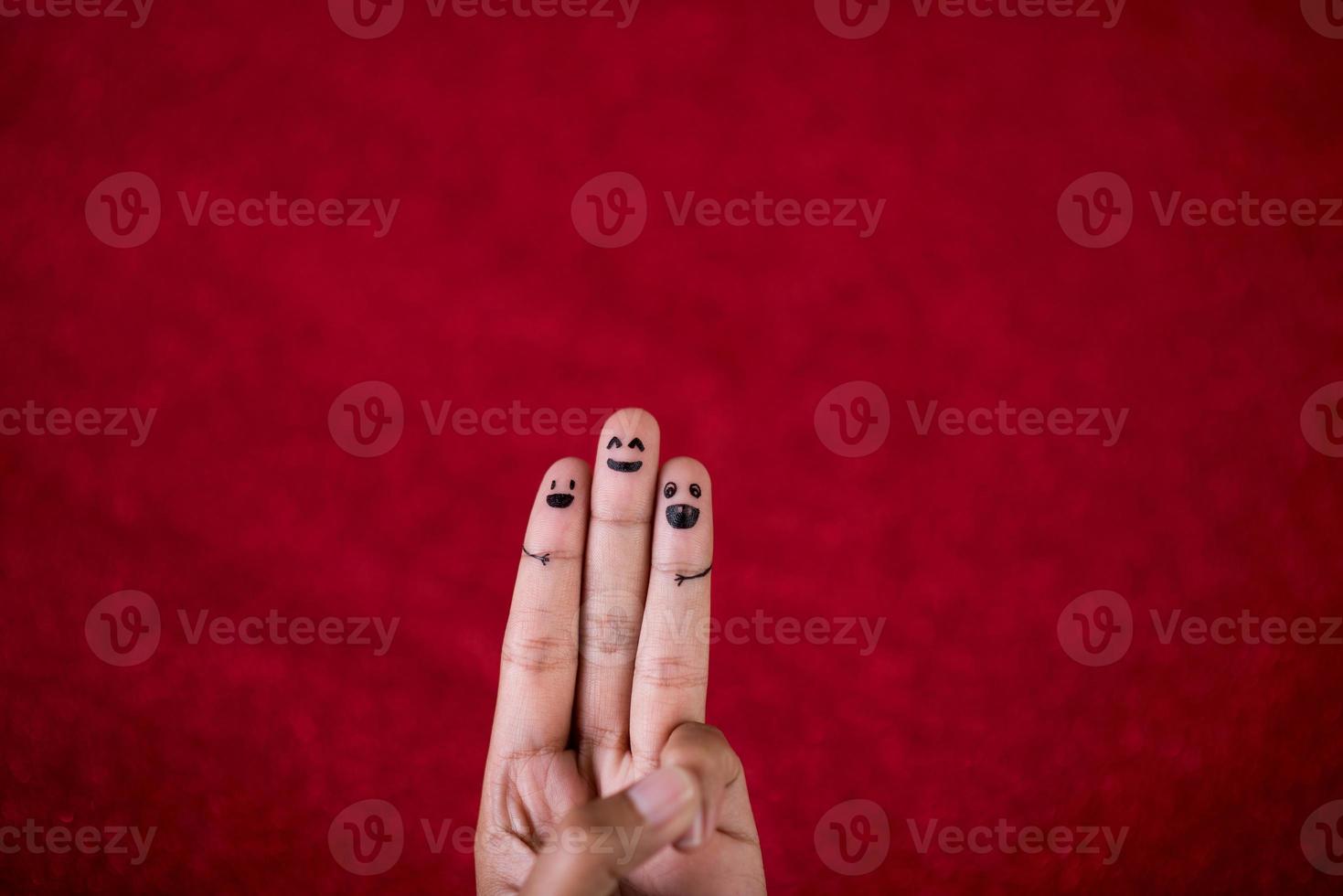 Red background and fingers and cute smile Art concept photo