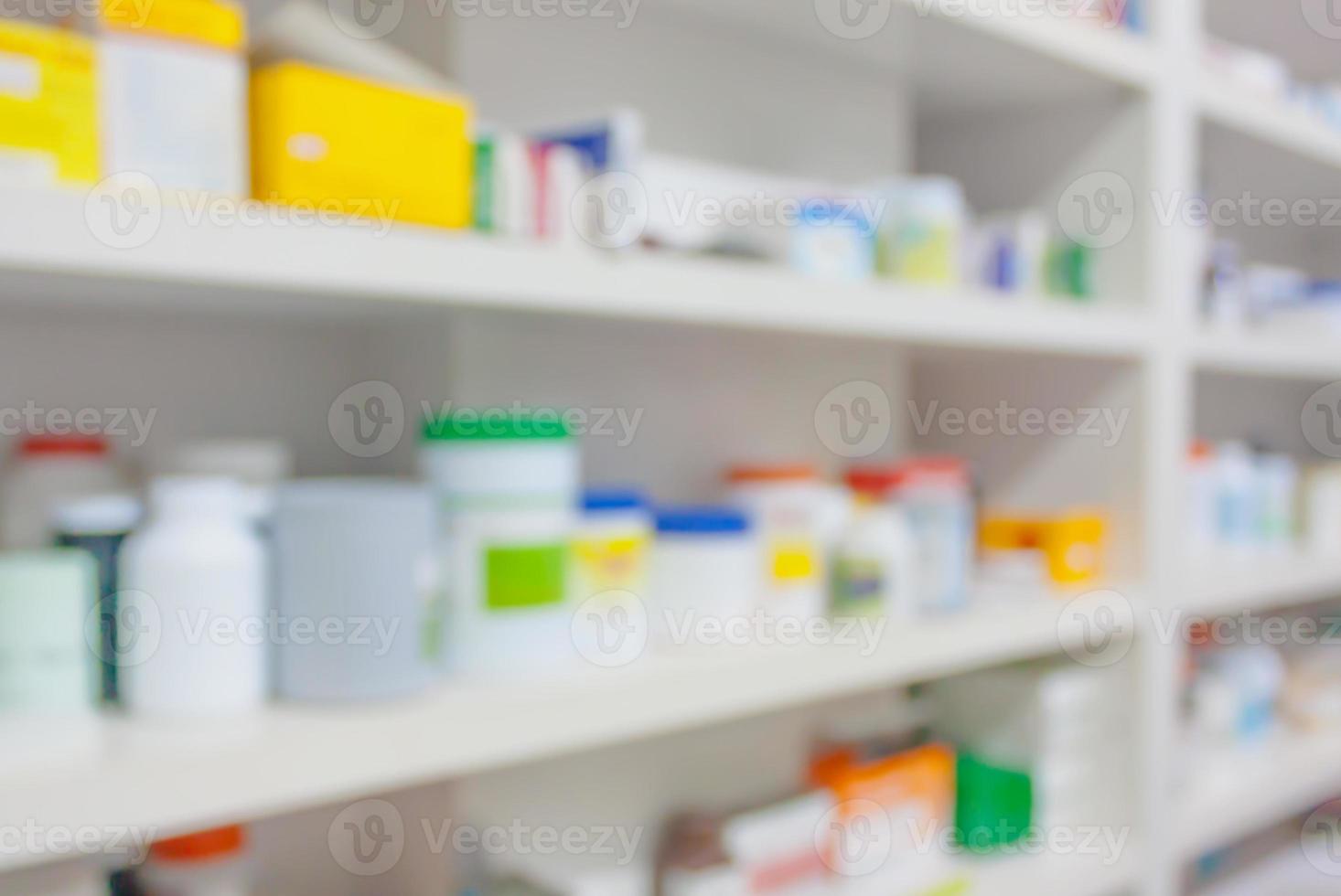 pharmacy store drugs shelves interior blurred background photo