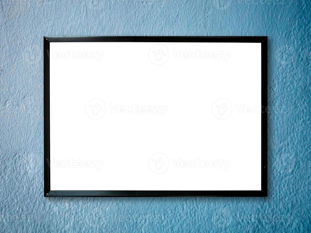 poster frame on blue paint wall background photo