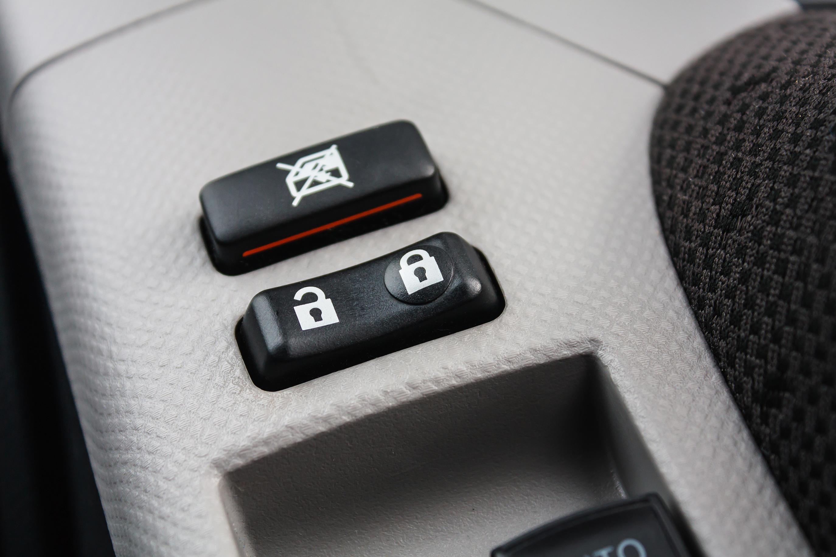 Car Door Lock Button Closeup. Electric Locking Button in Modern Car
