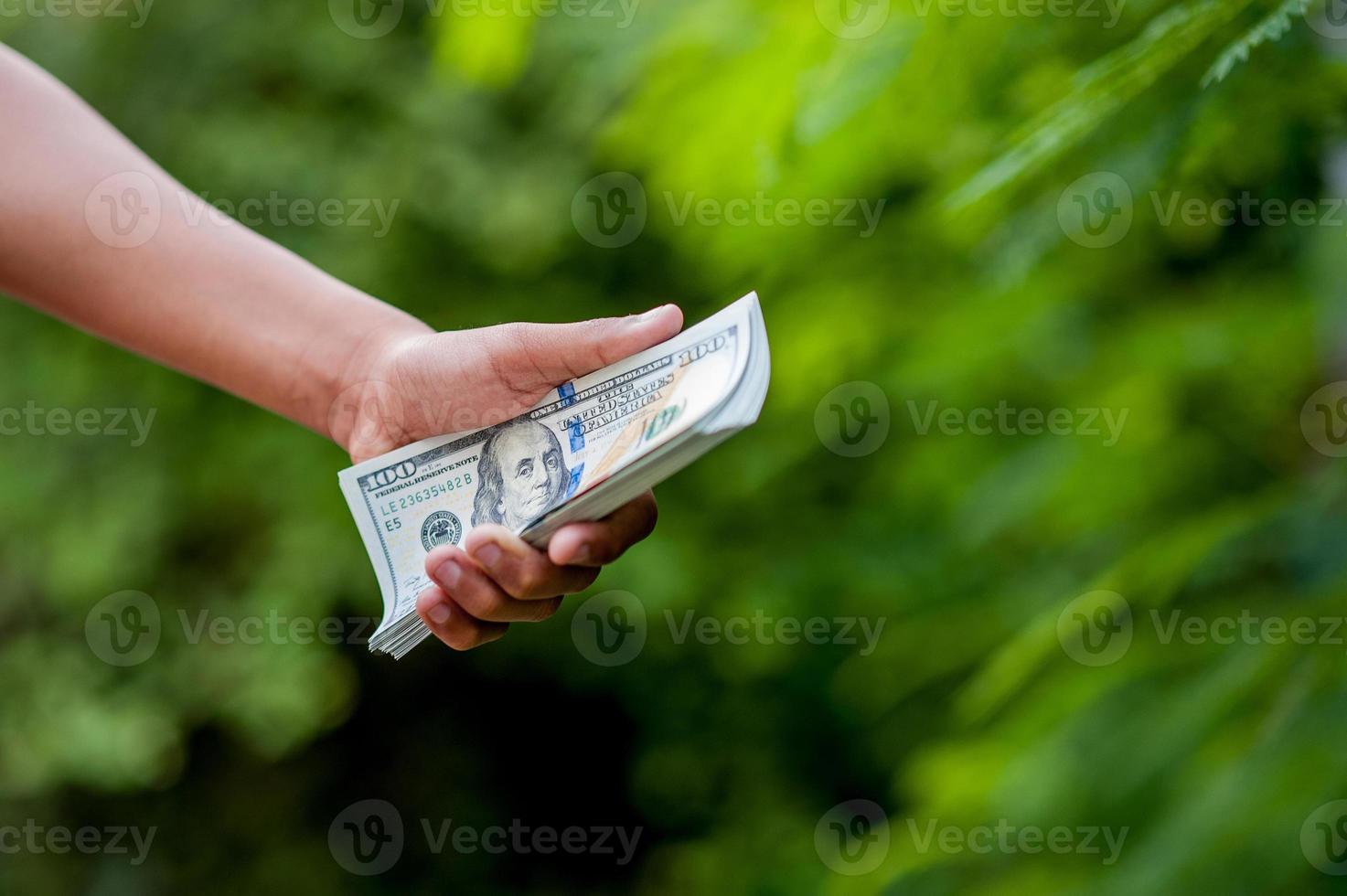 Hand and dollar pictures Concept of business finance photo