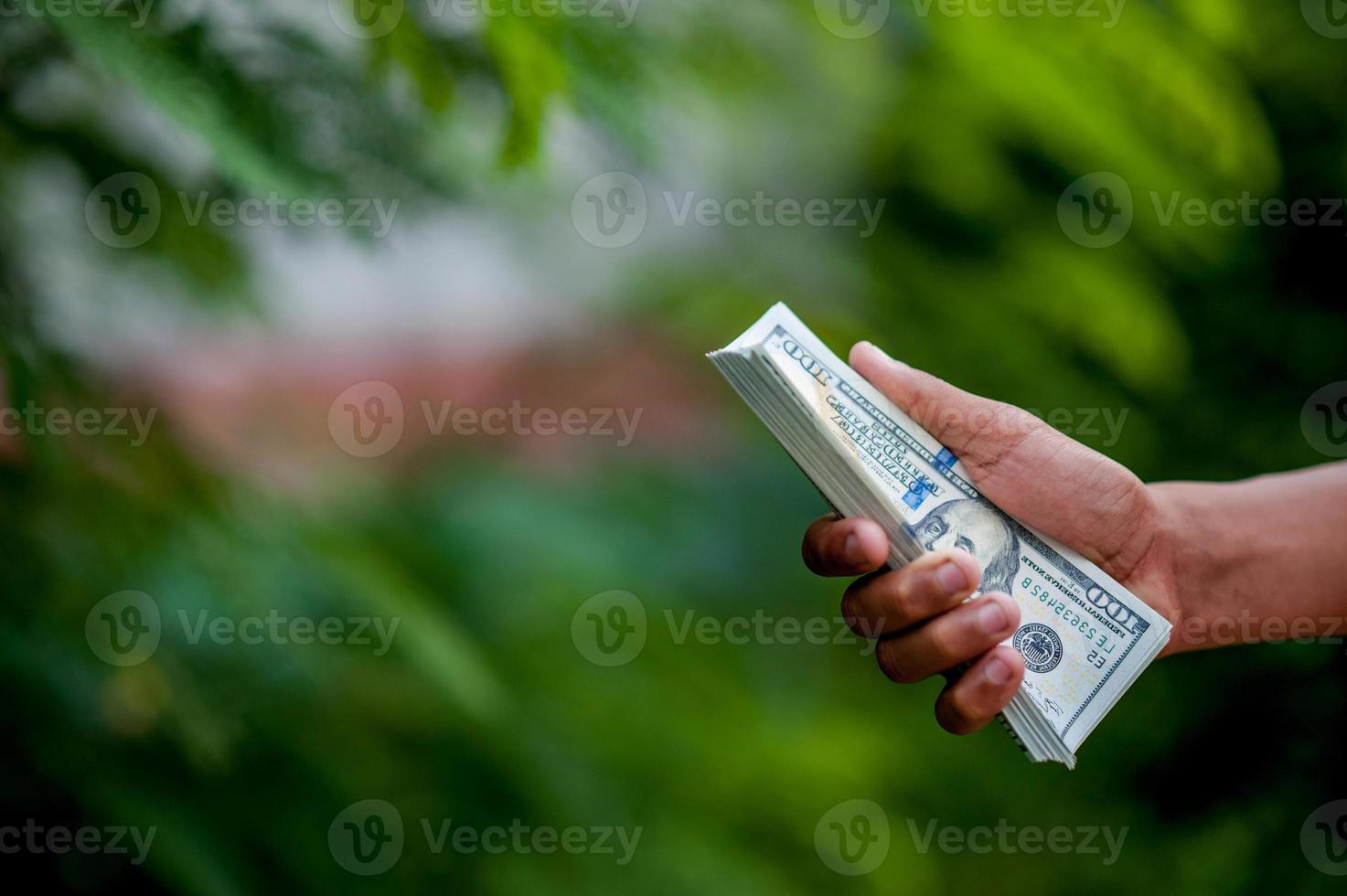 Hand and dollar pictures Concept of business finance photo