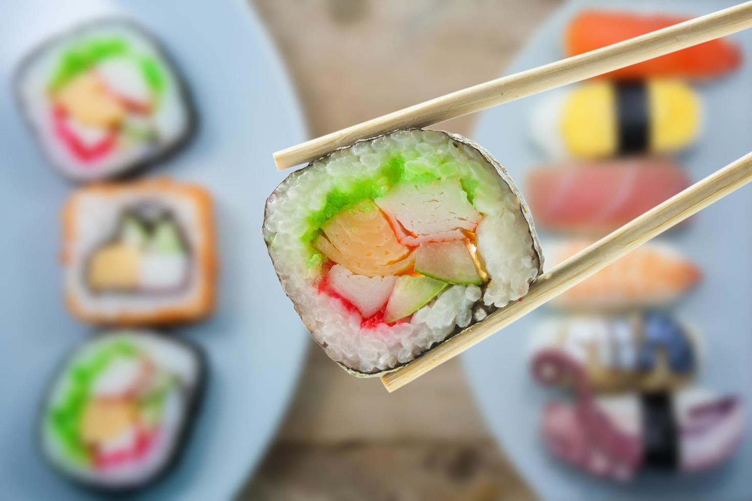 sushi with chopsticks photo