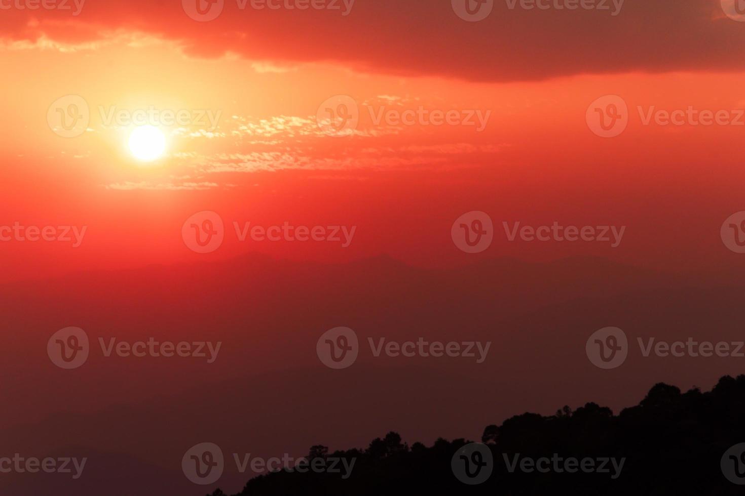 sky red color with sunset over mountains photo