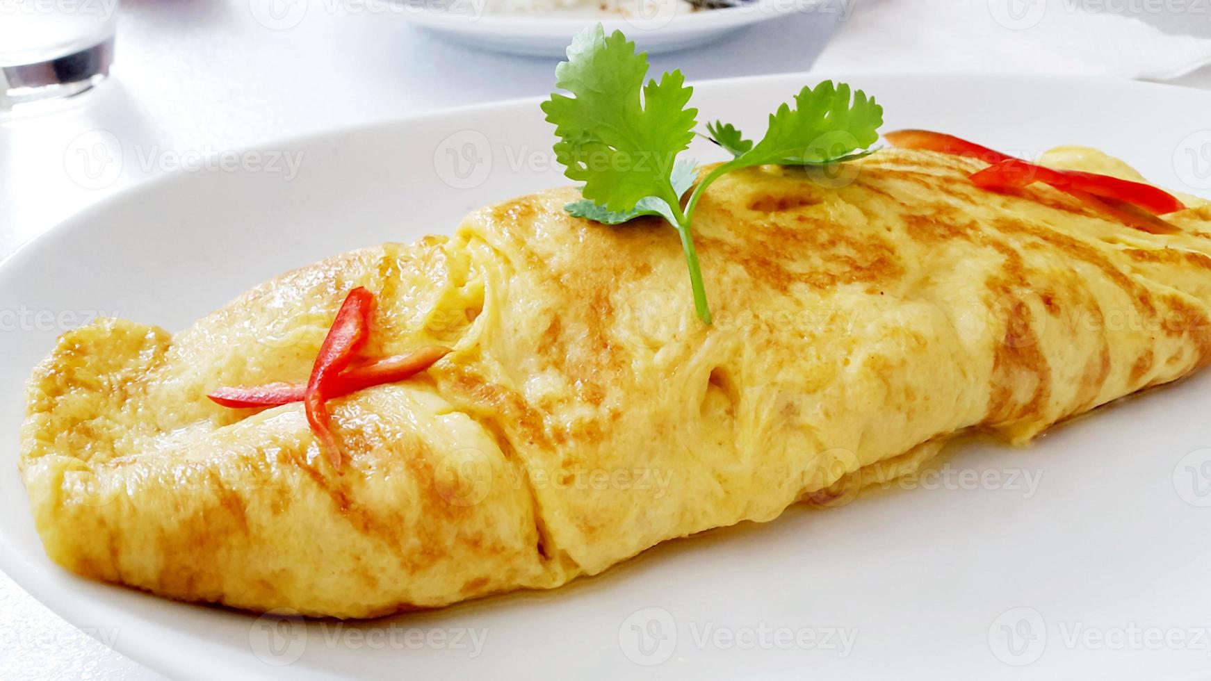 closeup of a plate with a typical tortilla de patatas, spanish omelet, on a set table photo