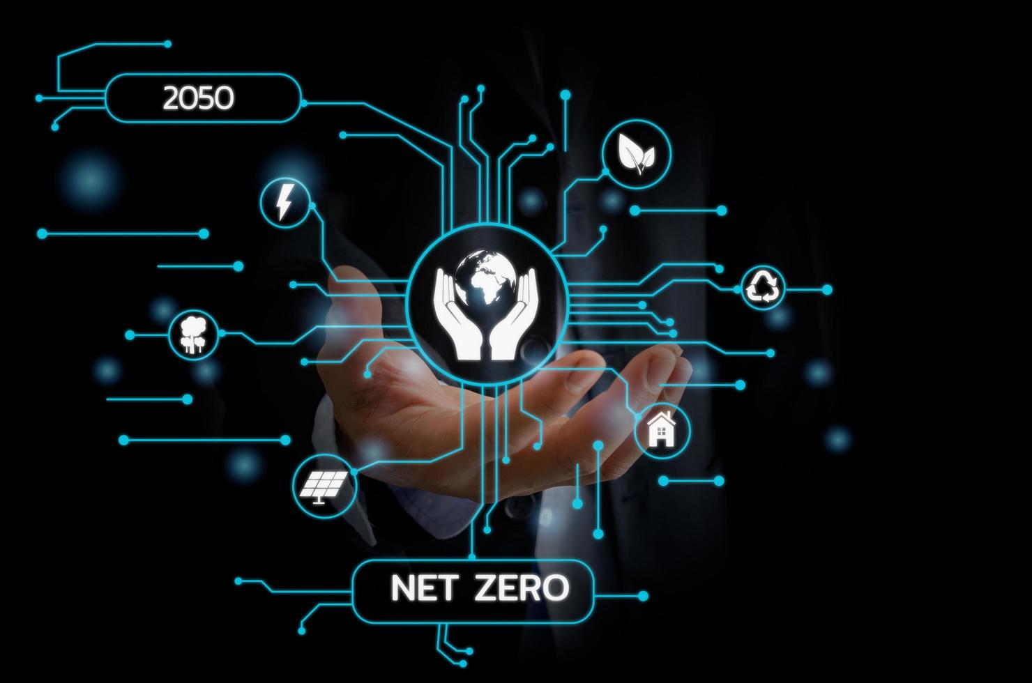Businessman touching net zero save the eco world and reduce pollution virtual screen. virtual screen Business Technology Concept. photo