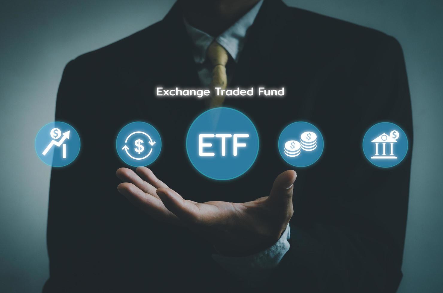 Hand businessman icon ETF Exchange Traded Fund virtual screen Internet Business stock market finance Index Fund Concept. photo