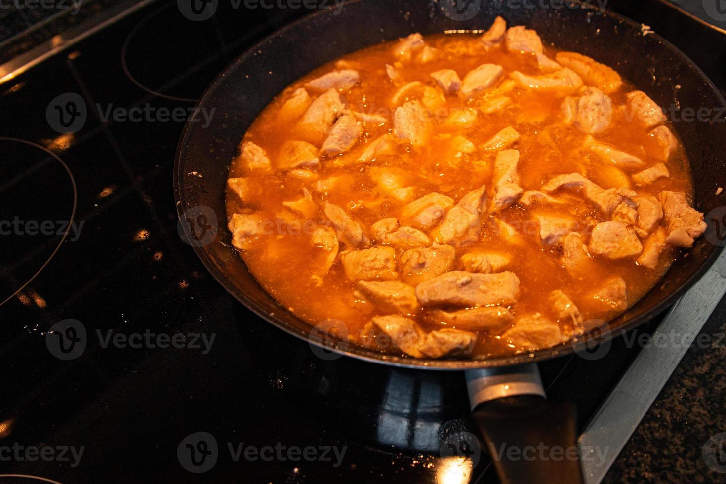 chicken meat in tomato sauce curry in frying pan cook meal 6742046 Stock  Photo at Vecteezy
