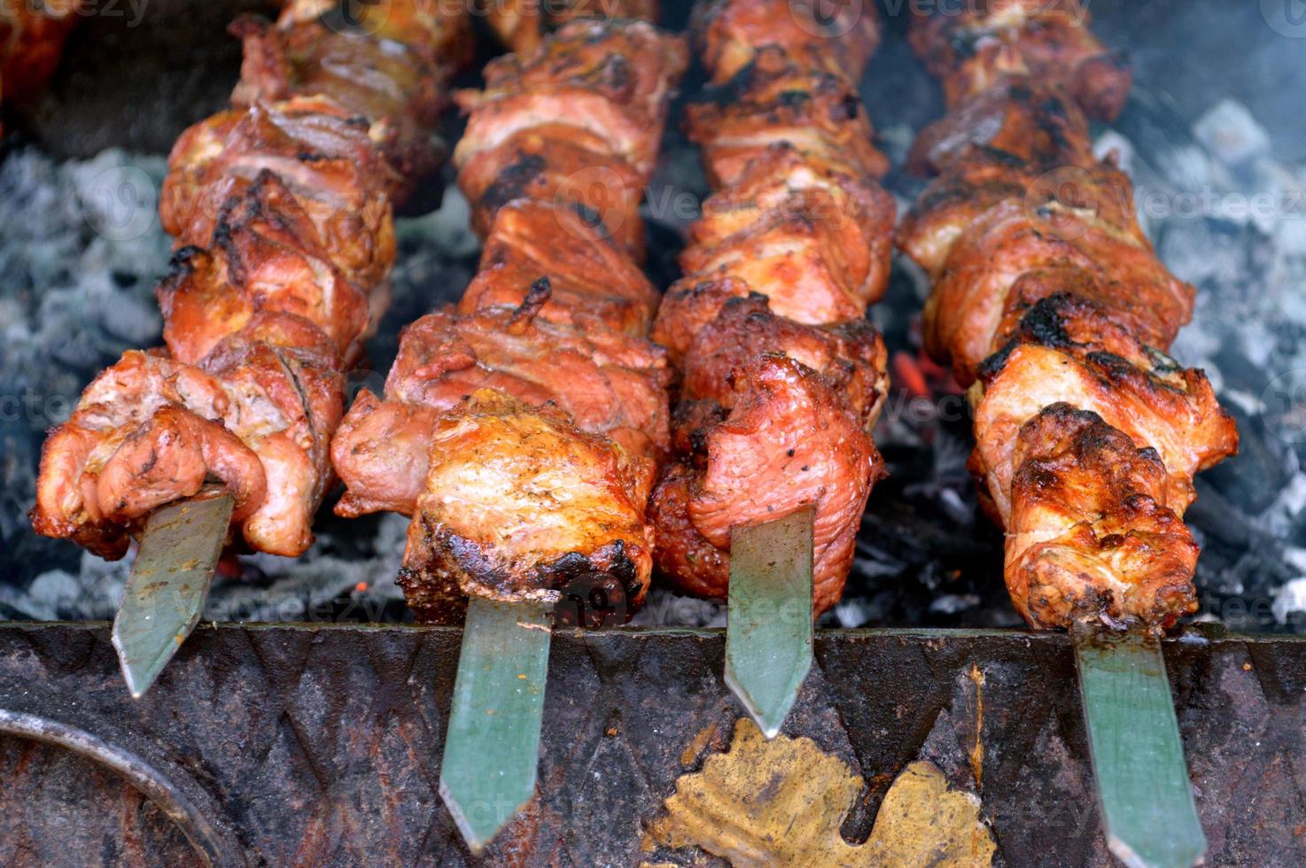 charcoal grill and skewered meat photo