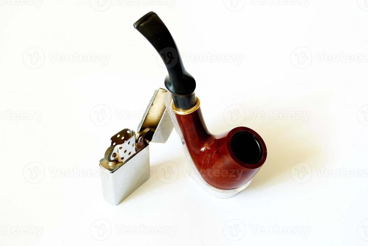 tobacco pipe and petrol lighter photo