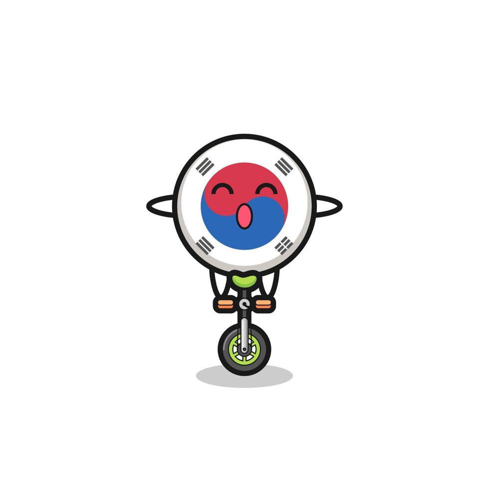 The cute south korea flag character is riding a circus bike vector