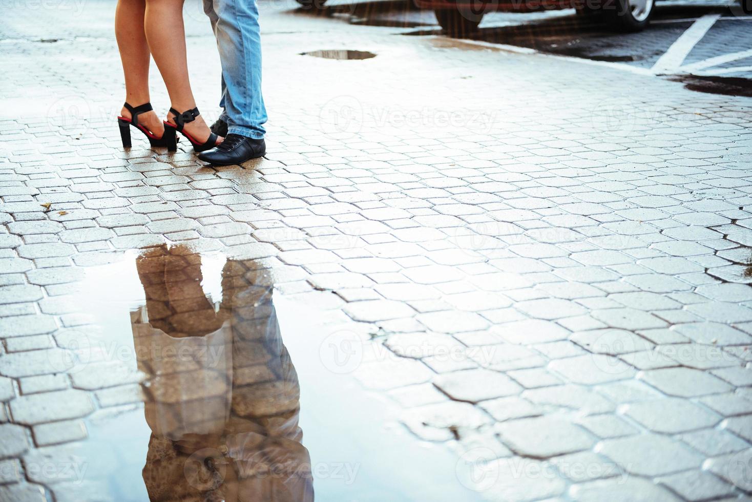 reflected in a puddle couple outdoors road photo