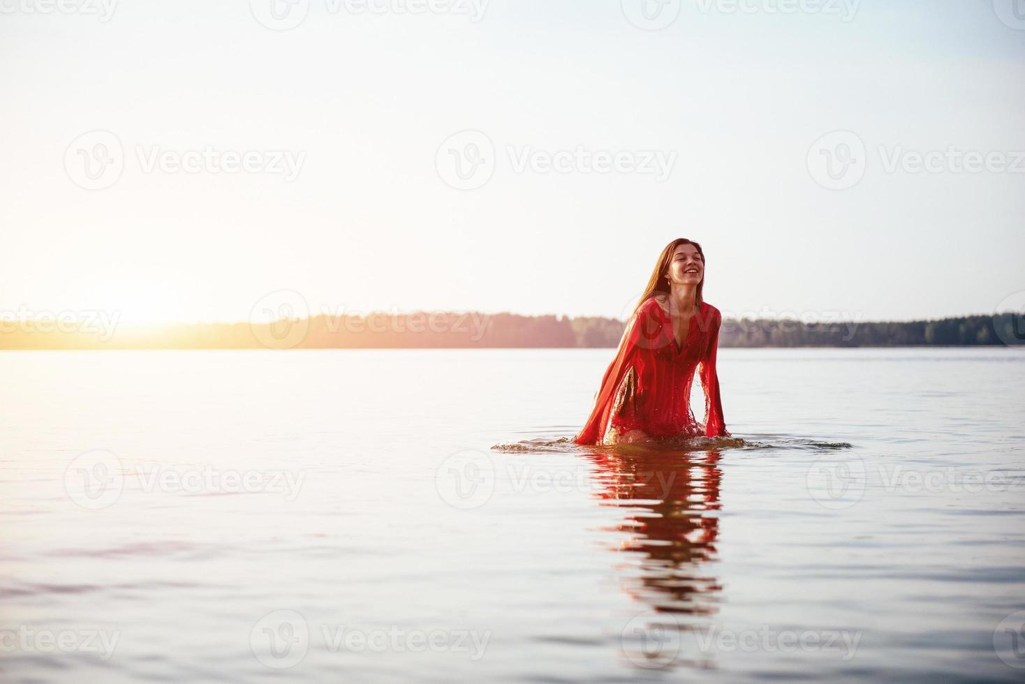 cute girl bathes in water photo