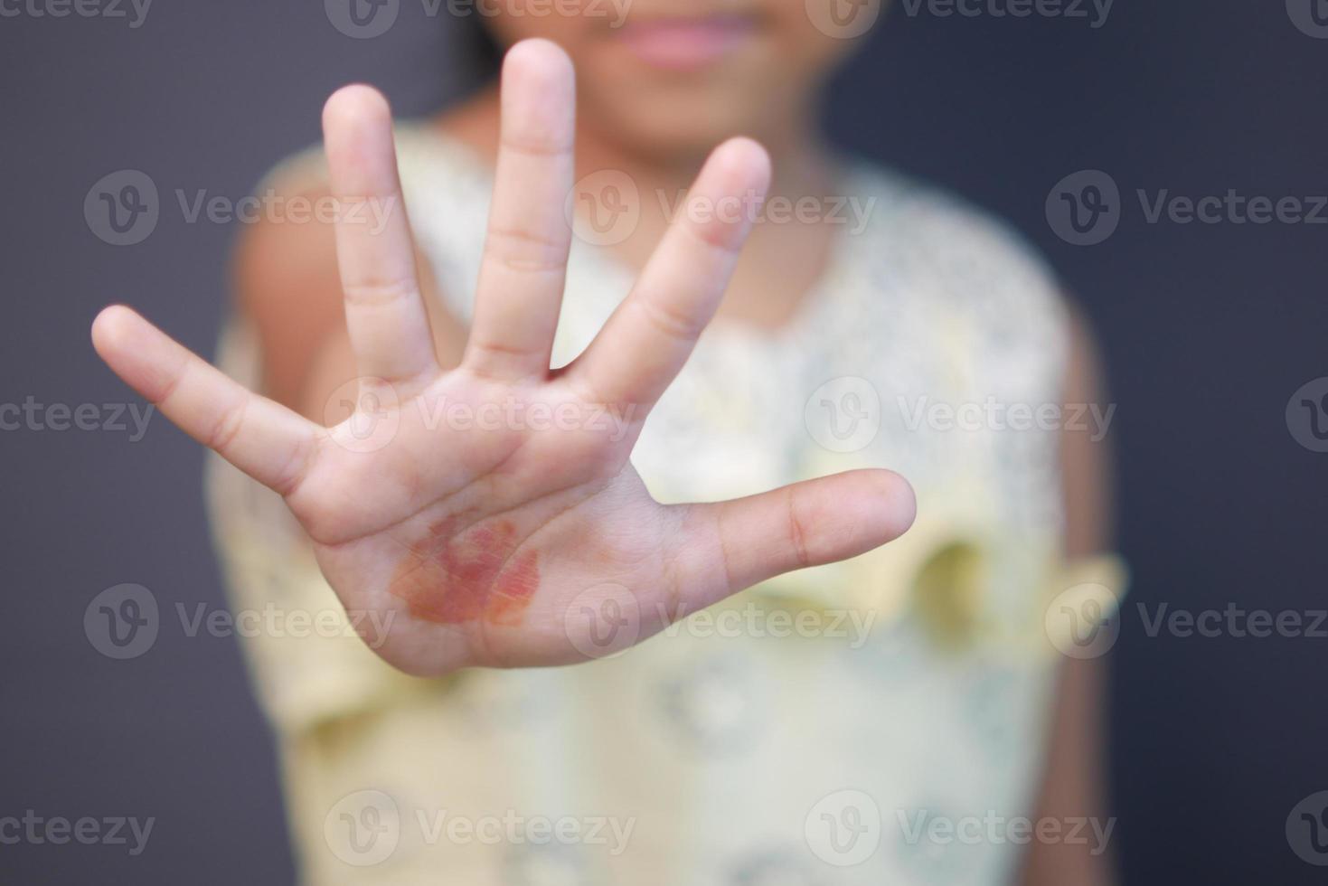 child girl show stop sigh isolated in black photo