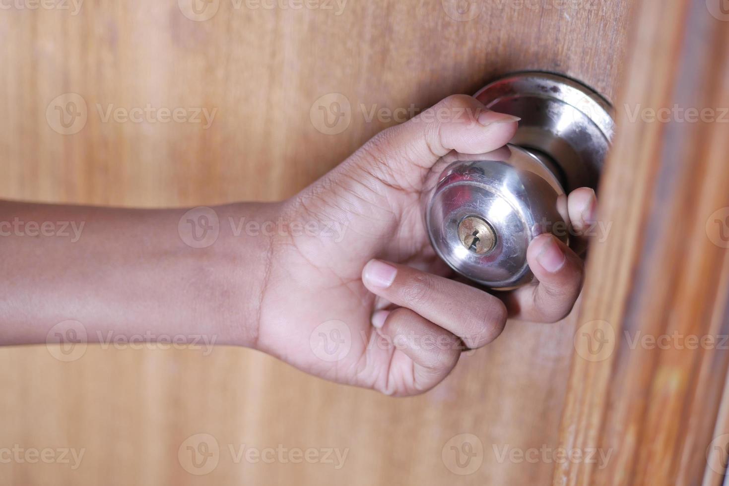 Man's Hand Opening door close up photo