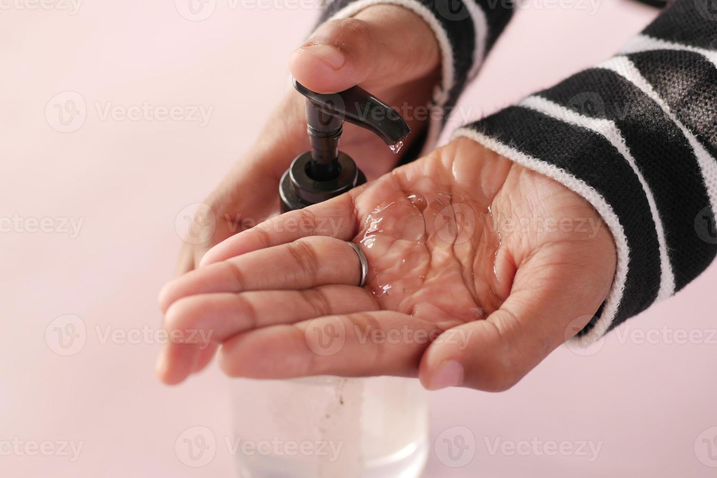 Using sanitizer liquid for preventing corona virus photo