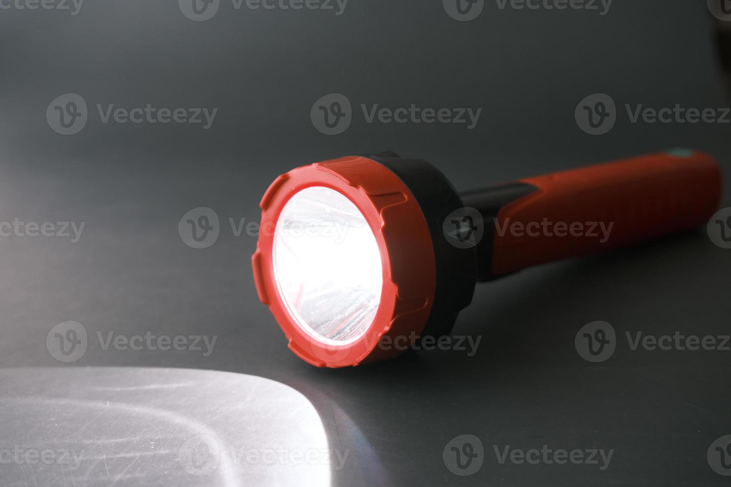 a tourch light on a black background, photo