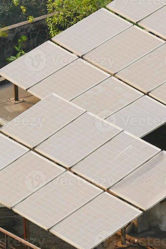 Solar pannels on a roof top photo