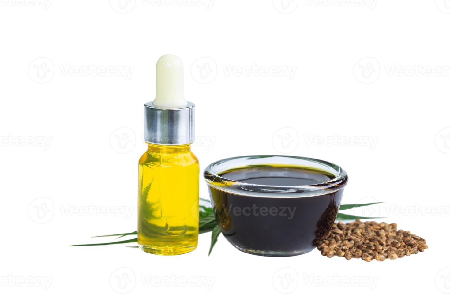 Hemp seeds and hemp oil on white background, CBD cannabis oil extract, marijuana  alternative herbal medicine concept. photo