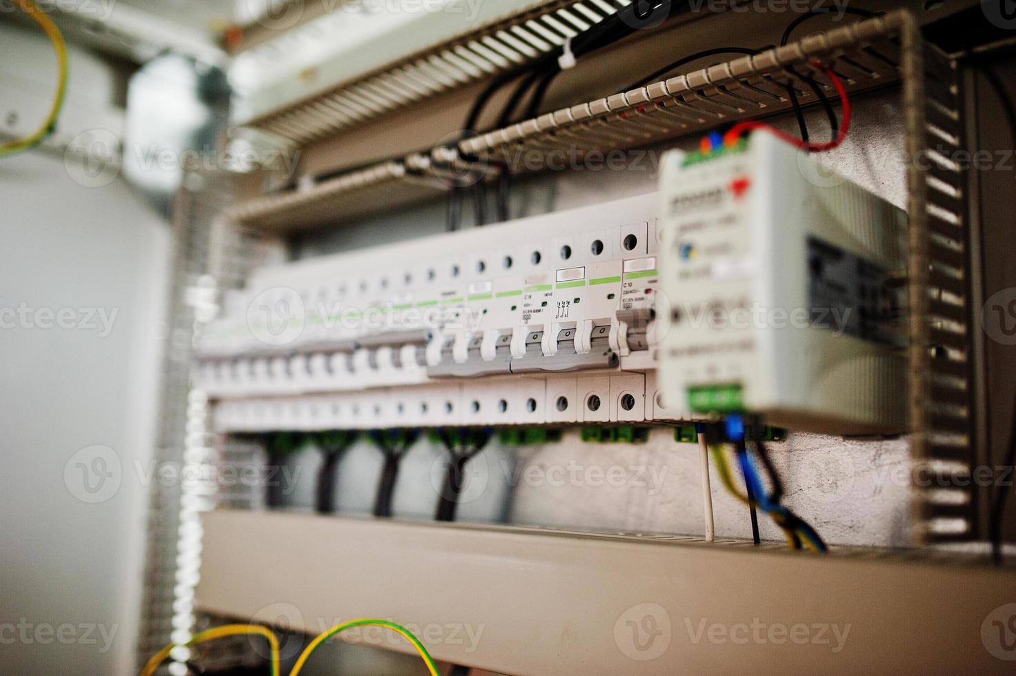 Electrical panel, electric meter and circuit breakers. Electric frequency converter, motor speed controller, rework station. photo