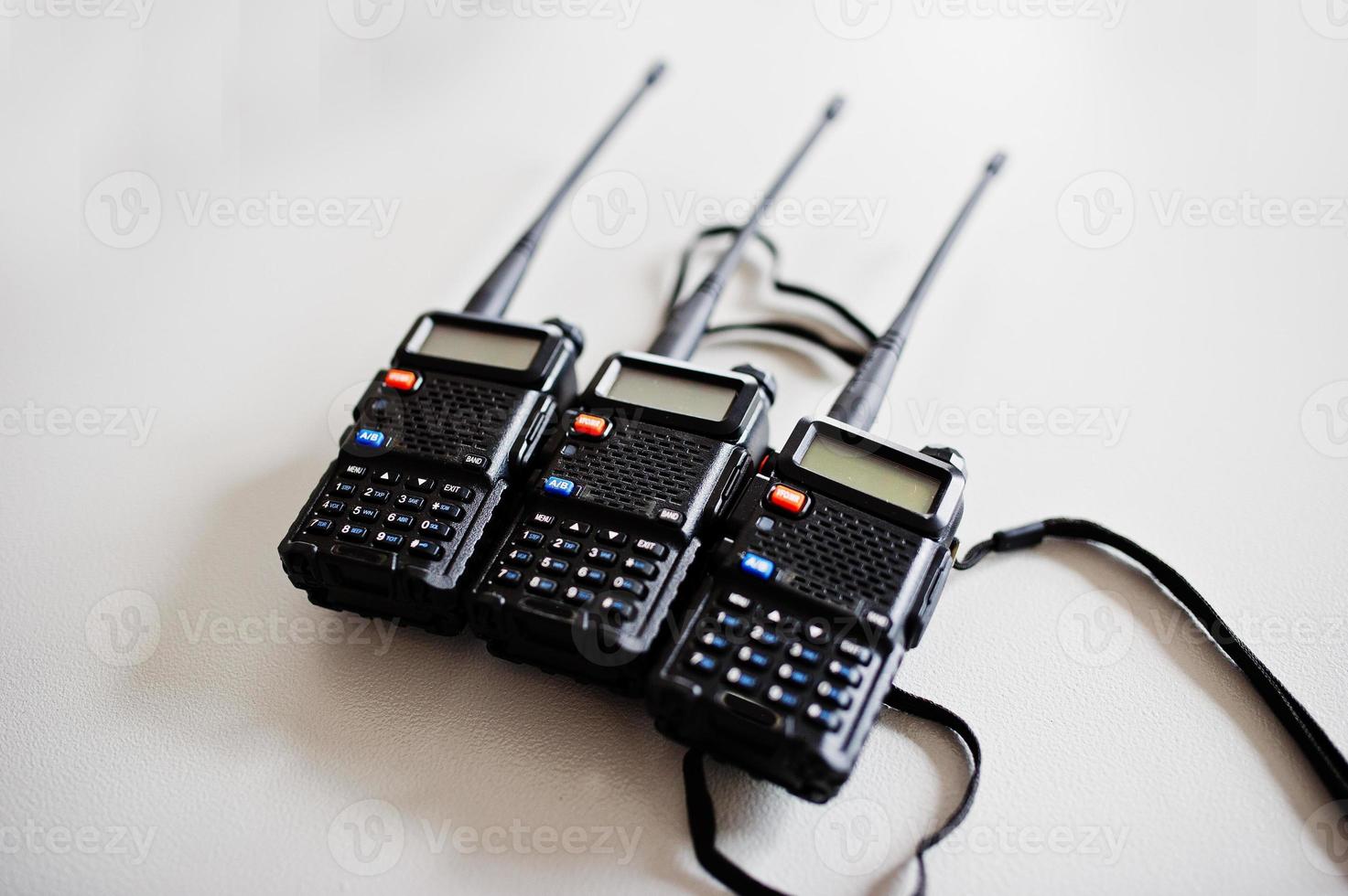 Three portable radio transmitter at steel background. photo