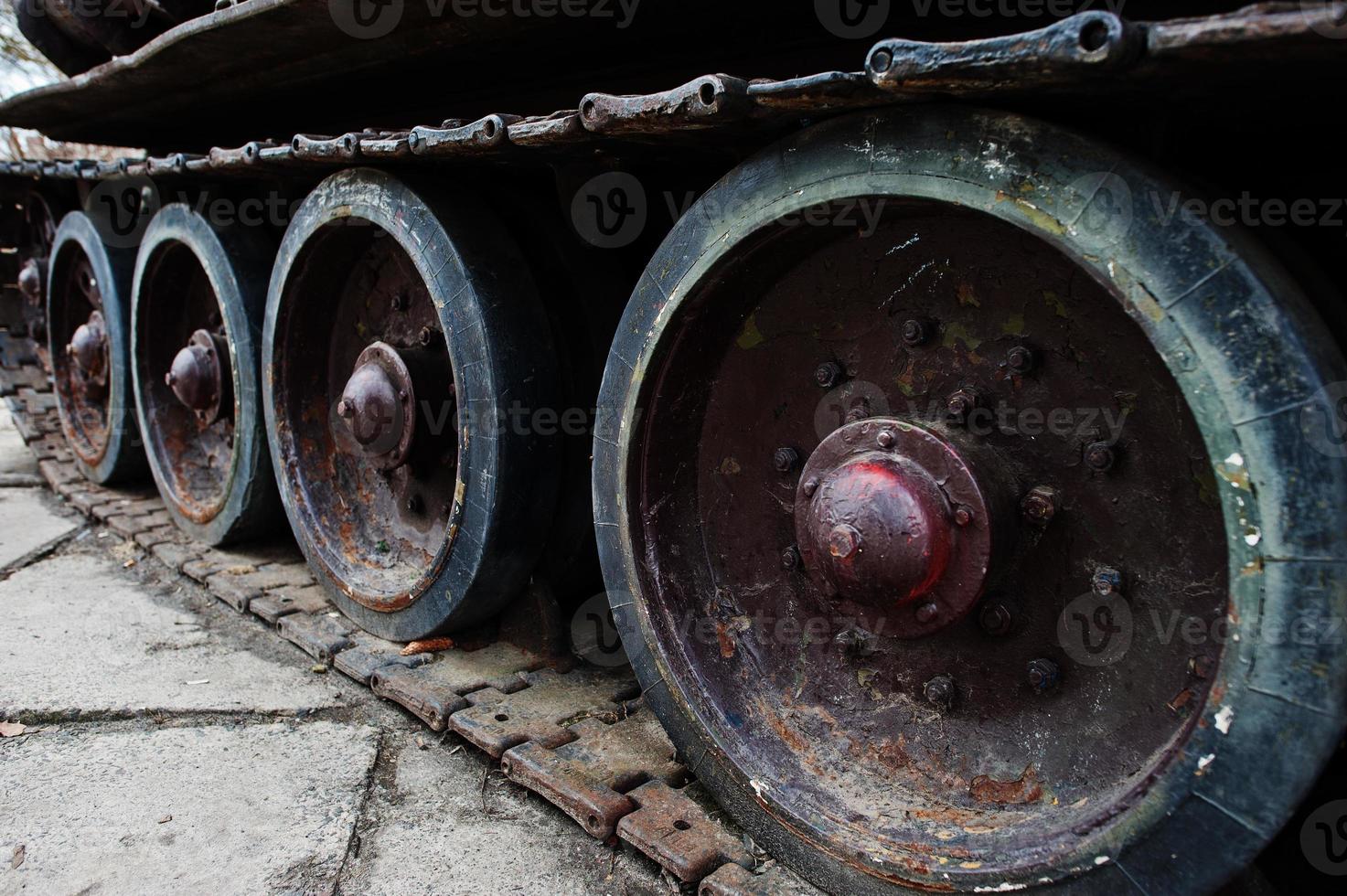 Detail shot with old vintage tank tracks and wheels. photo