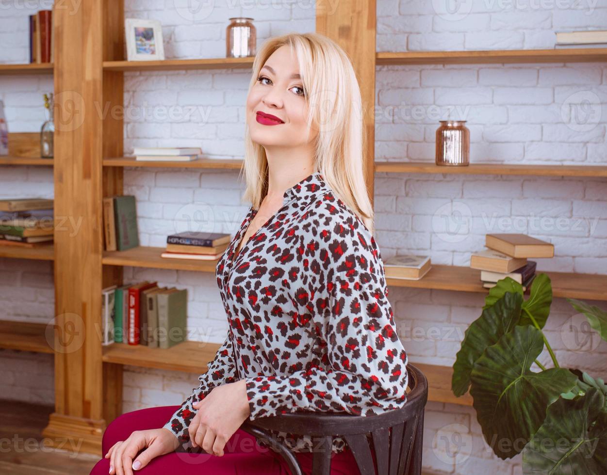 cheerful smiling blonde professional business lady  in office photo