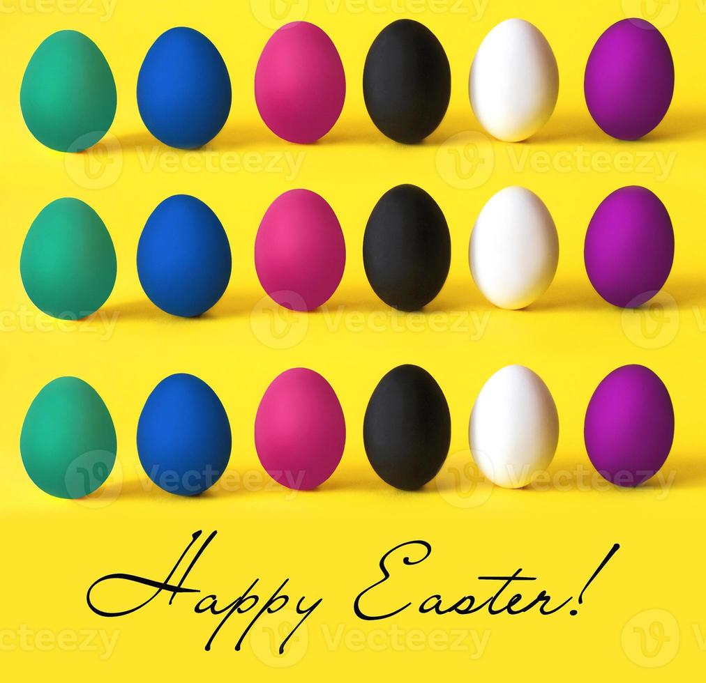 Colorful eggs on the yellow background. Easter, diversity, food concept photo