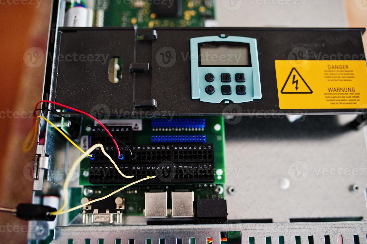 Electrical panel, electric meter and circuit breakers. Electric frequency converter, motor speed controller, rework station. photo