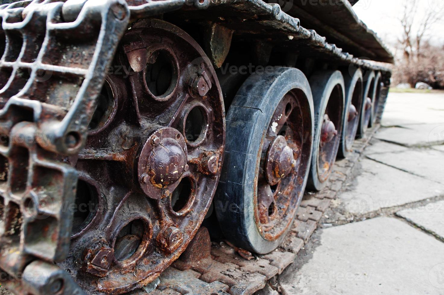 Detail shot with old vintage tank tracks and wheels. photo