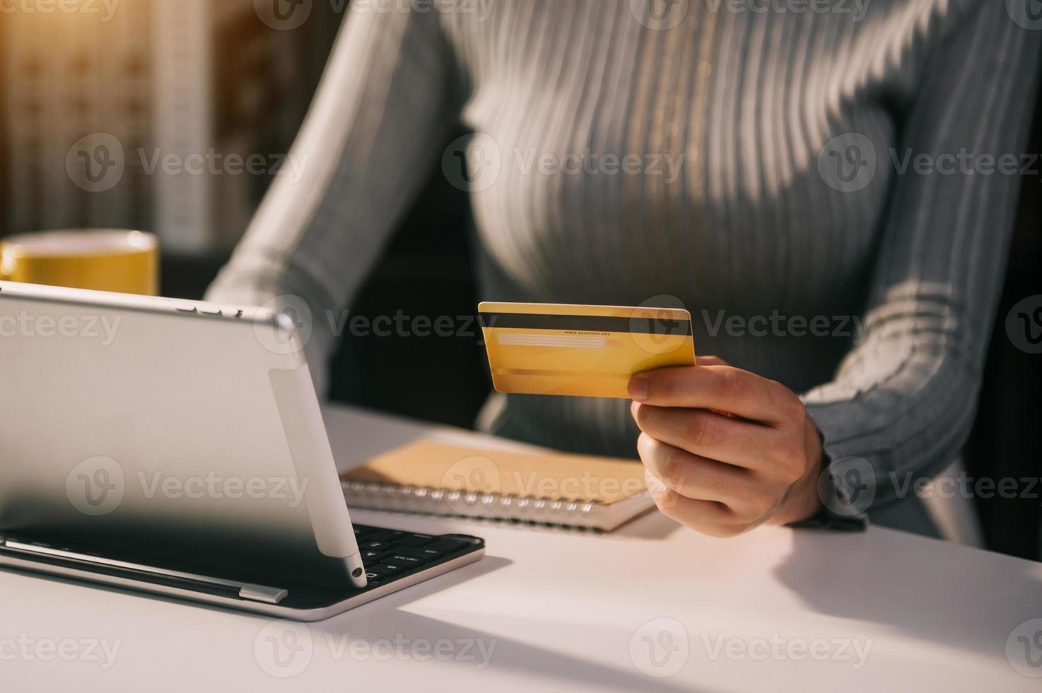 Business woman hands using smartphone and holding credit card with digital layer effect diagram as Online shopping photo