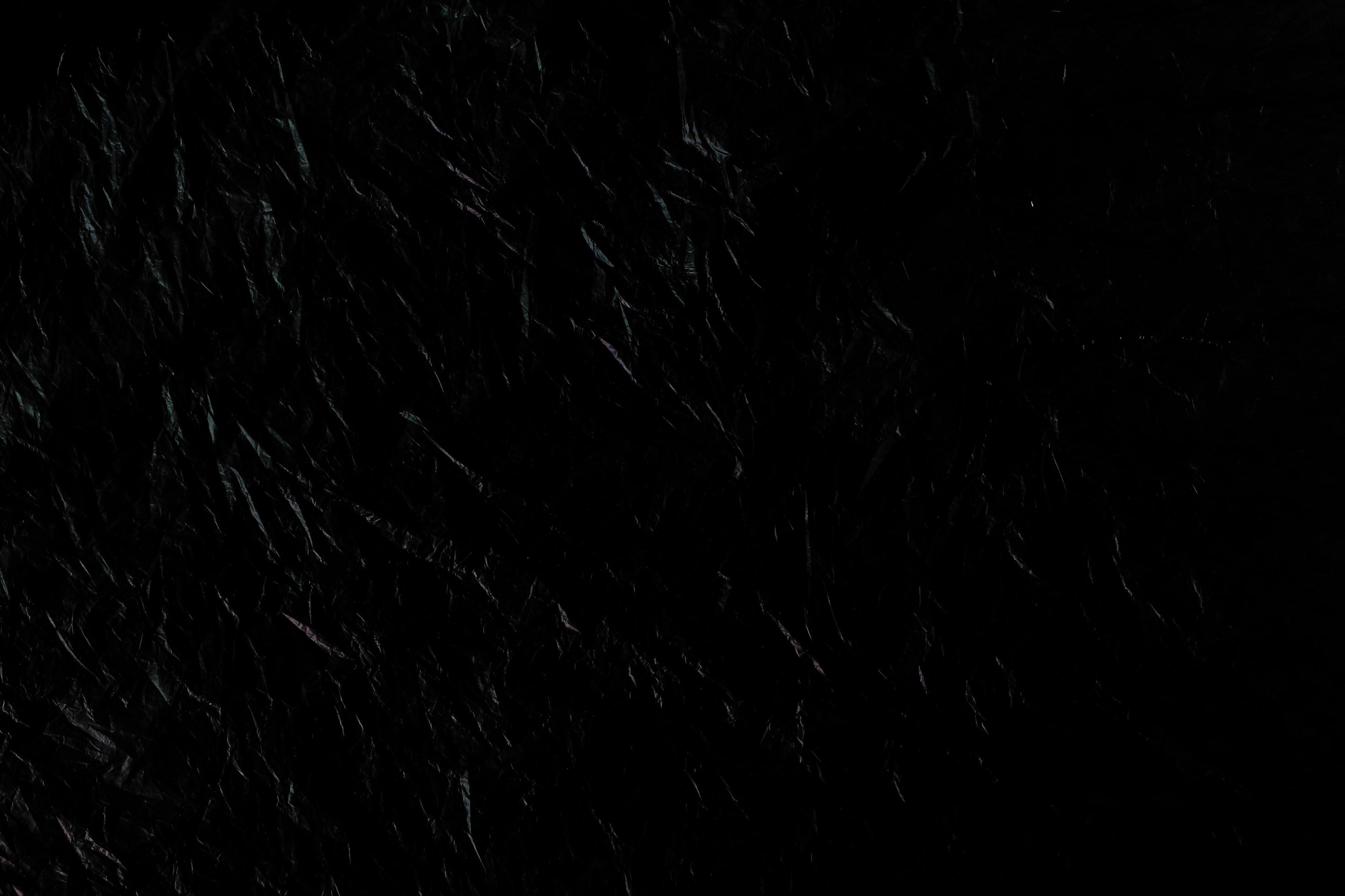 Black wrinkled plastic texture for background. 6761044 Stock Photo at  Vecteezy