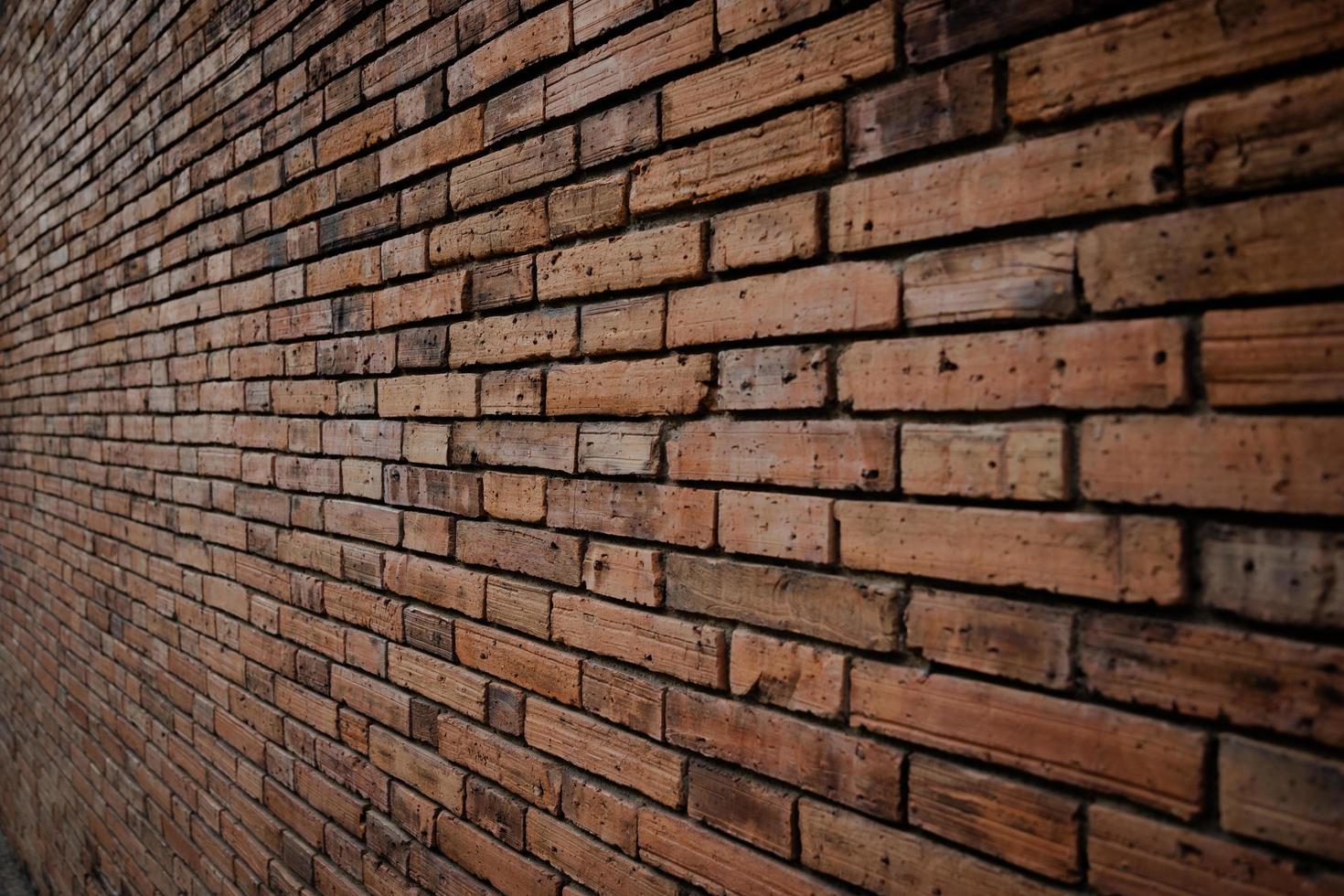 Old red brick wall background, Side-focus shot in the center of the frame photo