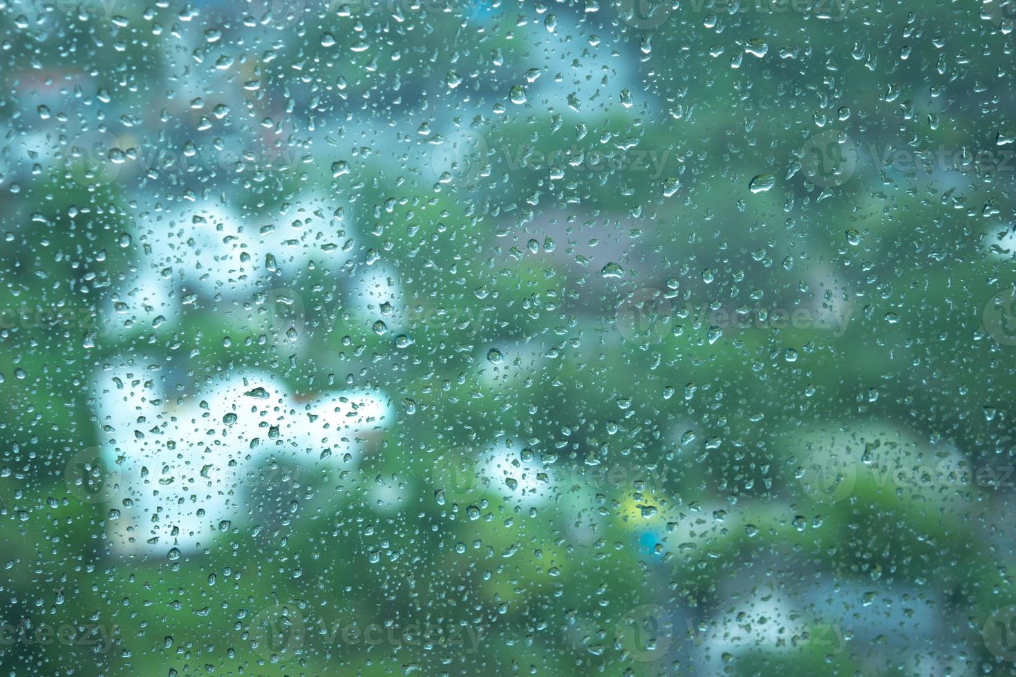 Water drops on glass, rain drop background texture photo