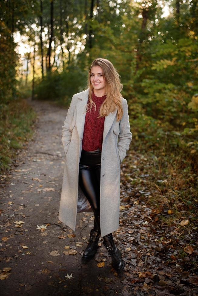 Portrait of a beautiful autumn woman. Girl posing to the camera. photo