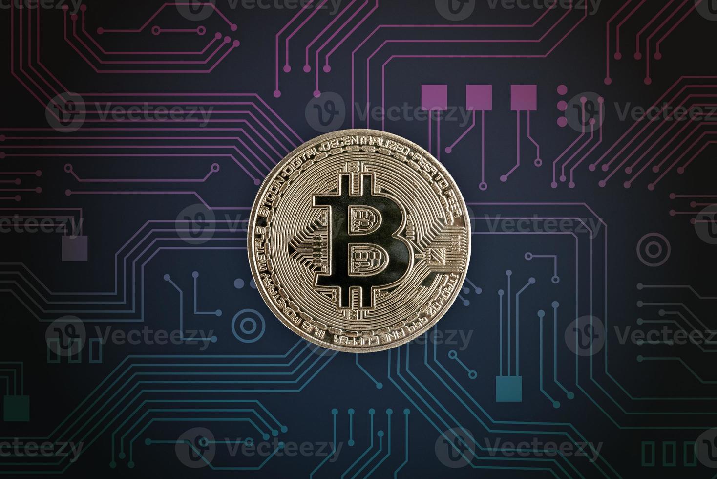 Bitcoin on electronic circuit board. Digital crypto currency concept photo