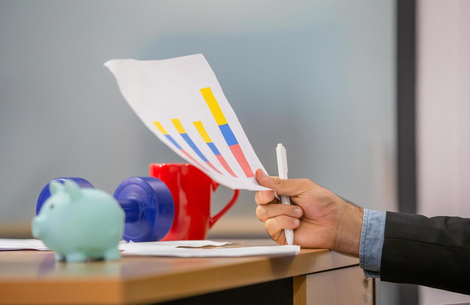 Close up of hand hold paper documents, Businessman holding papers hands in modern coworking office, man reading documents photo