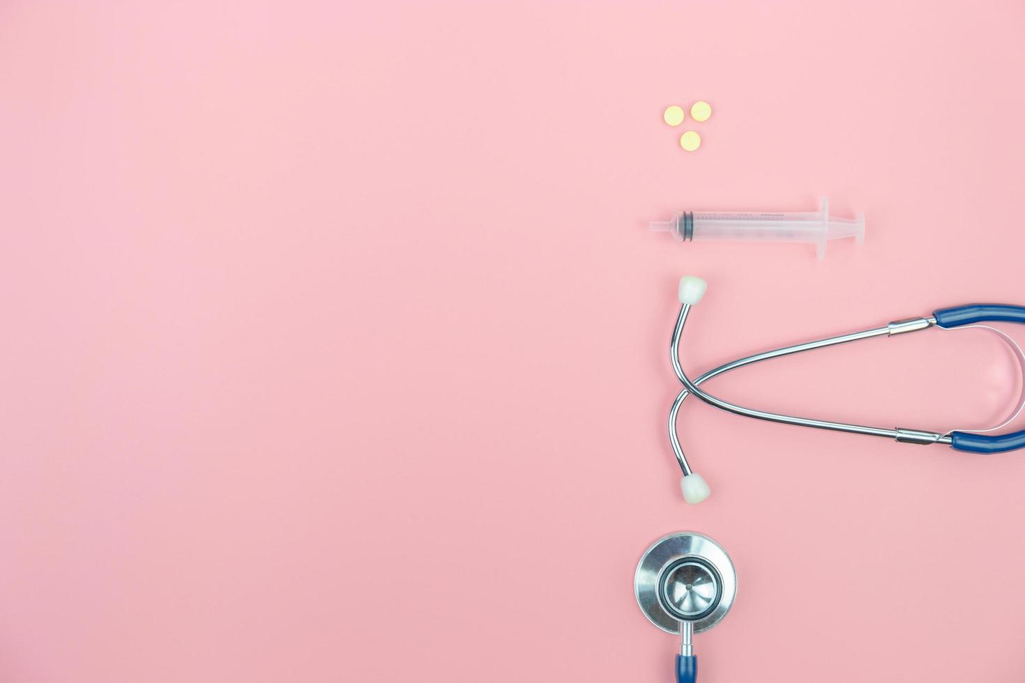 Top view with copy space of Stethoscope on the pink background, Medical and Healthy concept photo