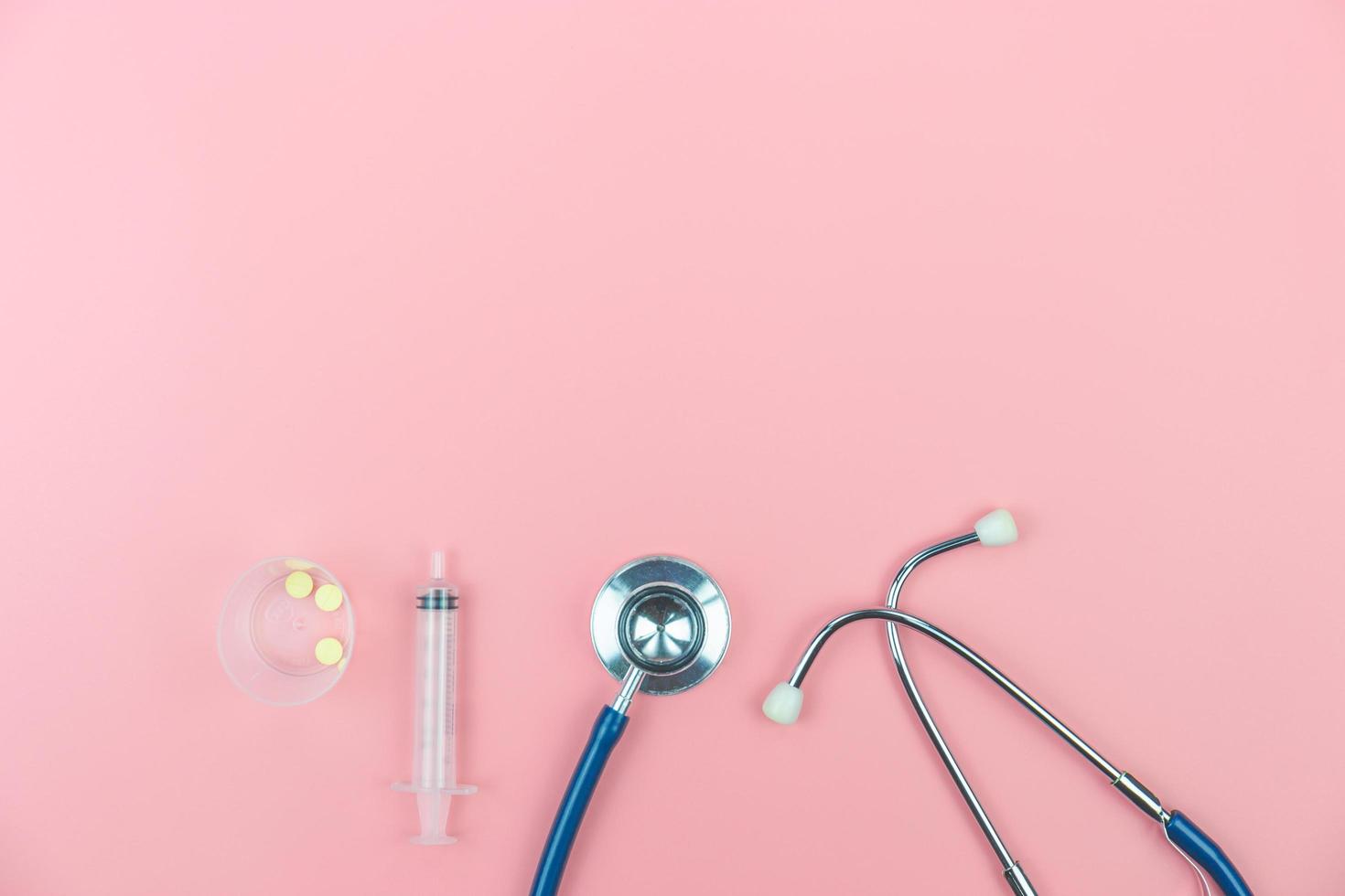 Top view with copy space of Stethoscope on the pink background, Medical and Healthy concept photo