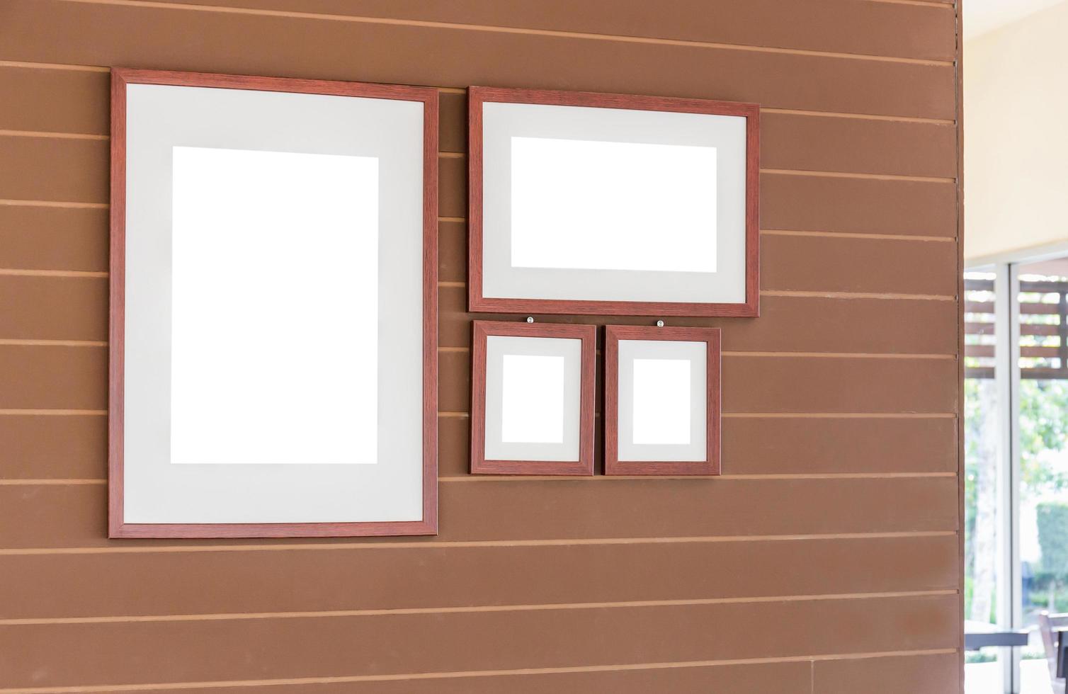 Group of Blank photo frames on the wall for your design