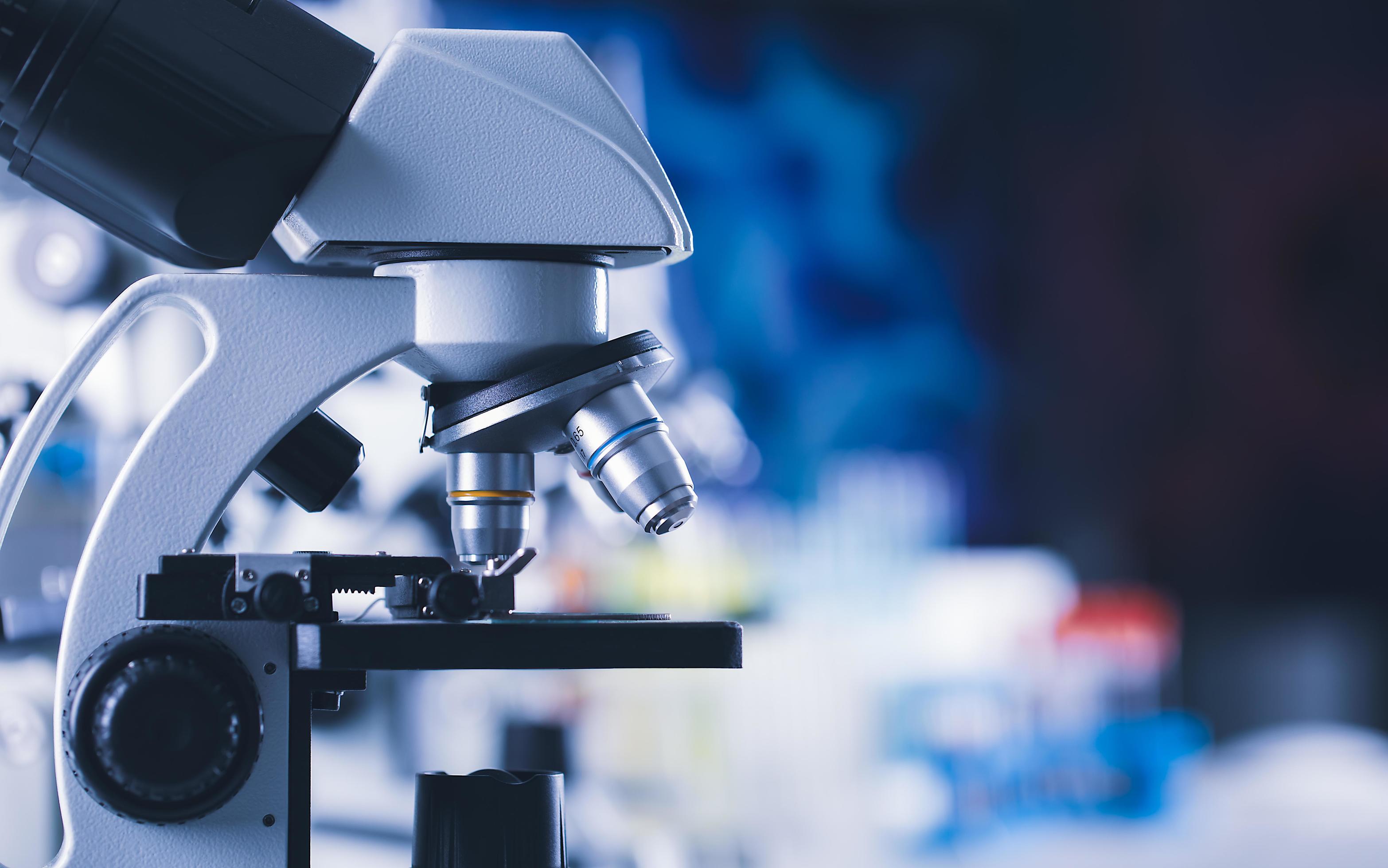 Close up shot of microscope medical equipment and colorful blur